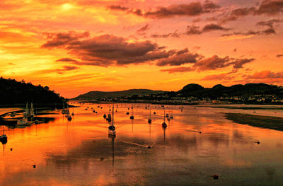 Scenic view of lake against sky during sunset