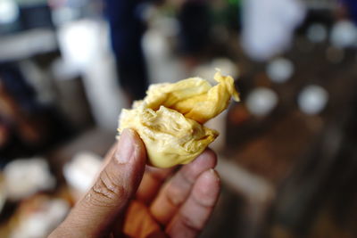 Sweet and aromatic durian fruit on your hand