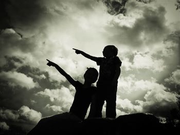 Low angle view of statue against cloudy sky