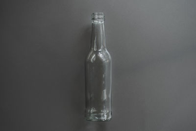 Close-up of glass bottle on table