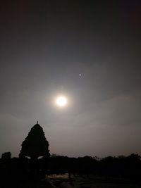 Scenic view of silhouette moon against sky at sunset