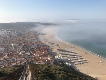 High angle view of road by sea against sky