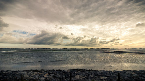 View of calm sea against cloudy sky