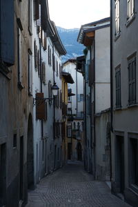 Narrow alley amidst buildings in city