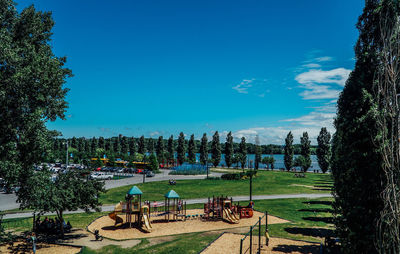 People in park against blue sky