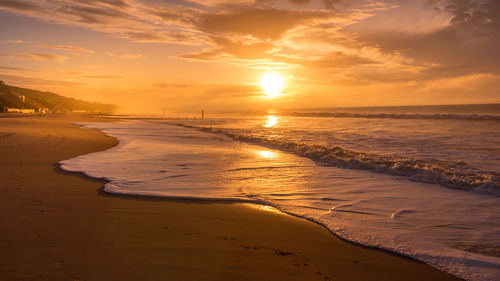 Scenic view of sea against sky during sunrise