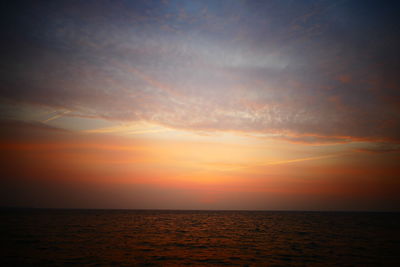 Scenic view of sea against sky at sunset