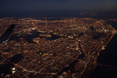 Aerial view of illuminated city at night