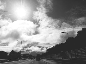 Low angle view of road against cloudy sky