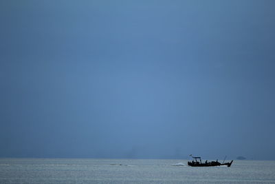 Boat in sea against clear sky