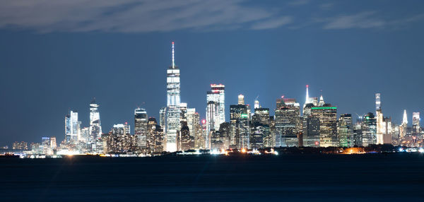 Illuminated buildings in city at night