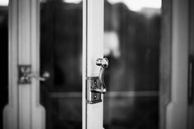 Close-up of faucet on door at home