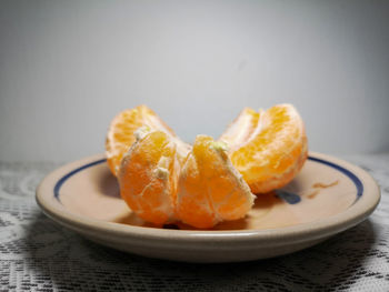 Close-up of orange slice in plate