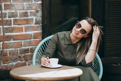 Young beautiful woman with long hair enjoying springtime.