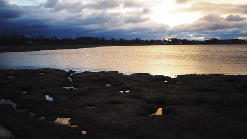 Scenic view of sea against sky at sunset