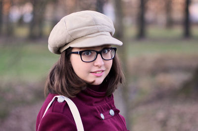 Portrait of teenage girl wearing eyeglasses and cap