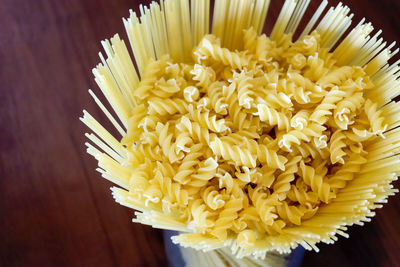 High angle view of yellow flower in container