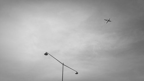 Low angle view of airplane flying in sky