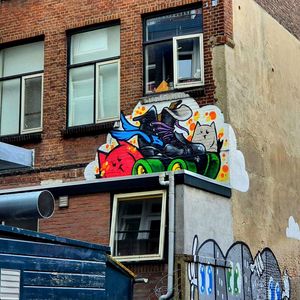 Low angle view of graffiti on wall of building