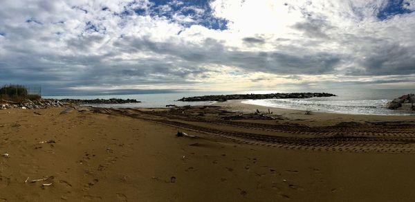 Scenic view of beach against sky