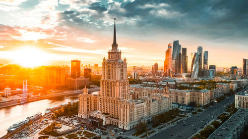 Cityscape against sky during sunset