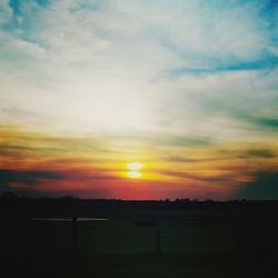 Scenic view of landscape at sunset