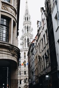 Low angle view of clock tower in city