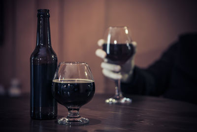 Close-up of wine glasses on table