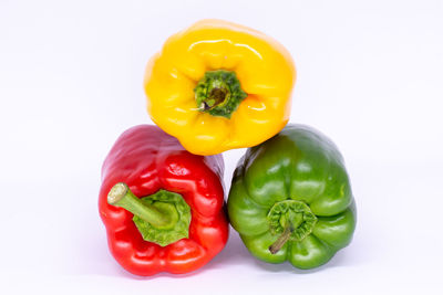 Close-up of bell peppers against white background