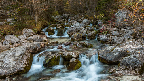 Scenic view of waterfall in stream