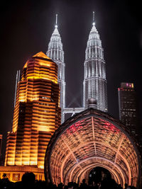 Low angle view of illuminated buildings at night