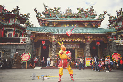 Group of people in temple outside building