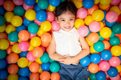 Portrait of woman with colorful balloons