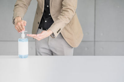 Midsection of woman holding ice cream