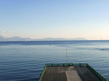 Scenic view of sea against clear sky during sunset