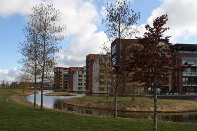 Buildings against cloudy sky