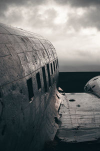 Low angle view of airplane flying against sky