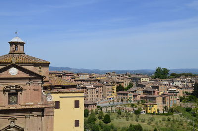 Buildings in city against sky