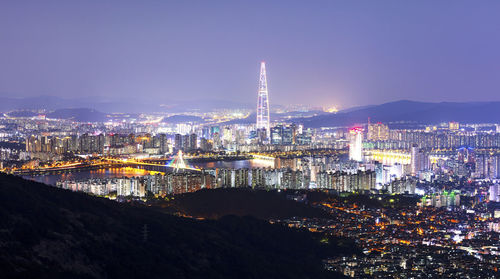 Illuminated buildings in city at night