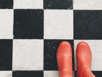 Rubber boots on tiled floor