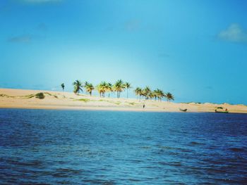 Scenic view of sea against clear blue sky