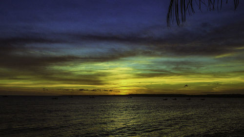 Scenic view of sea against dramatic sky