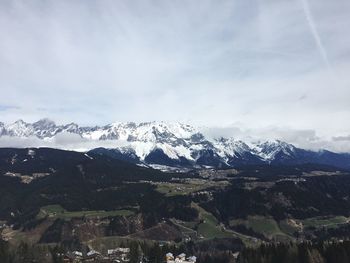 Scenic view of mountains against sky during winter