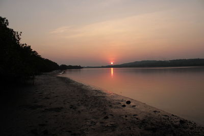 Scenic view of sunset over lake