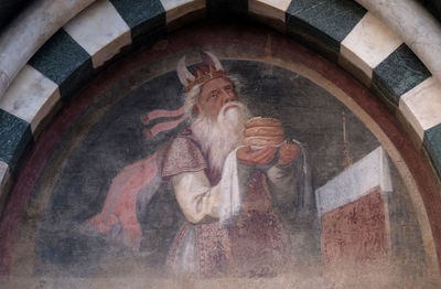 Low angle view of angel sculpture at temple