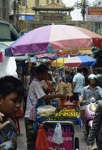 People at market in city