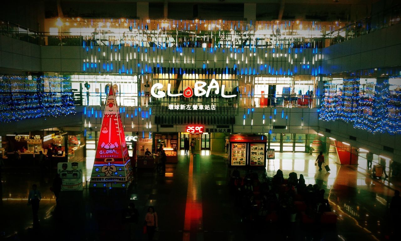 illuminated, built structure, architecture, city, reflection, indoors, large group of people, night, text, water, building exterior, city life, western script, restaurant, sea, incidental people, person, transportation, lifestyles