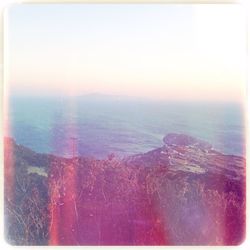 Scenic view of sea against sky at sunset