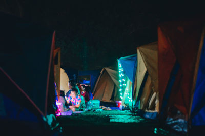 Group of people in illuminated room