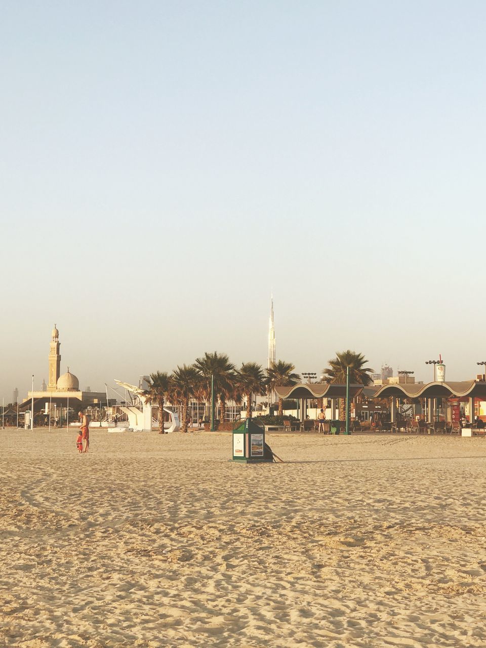 sand, beach, travel destinations, architecture, tourism, clear sky, built structure, travel, vacations, history, spirituality, place of worship, religion, outdoors, building exterior, dome, water, sea, day, sky, nature, no people, city